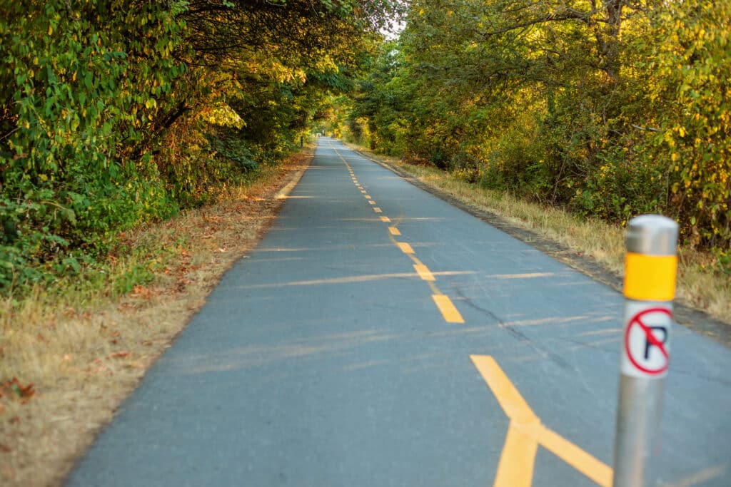 The evening light hits an empty Galloping Goose Regional Trail in Saanich/Victoria, BC